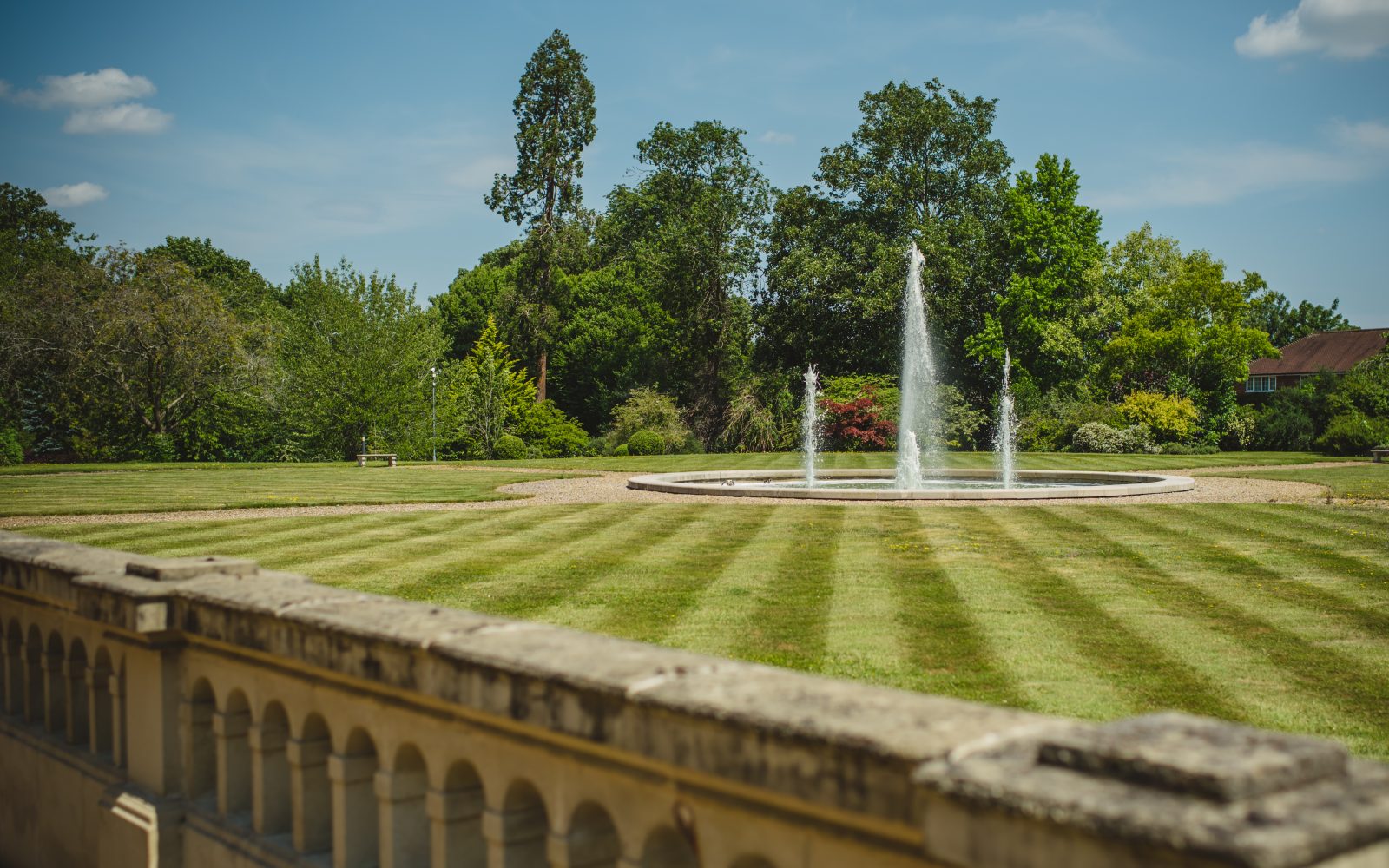 Acres of private landscaped grounds with fountains available at Fetcham Park's serviced offices in Leatherhead