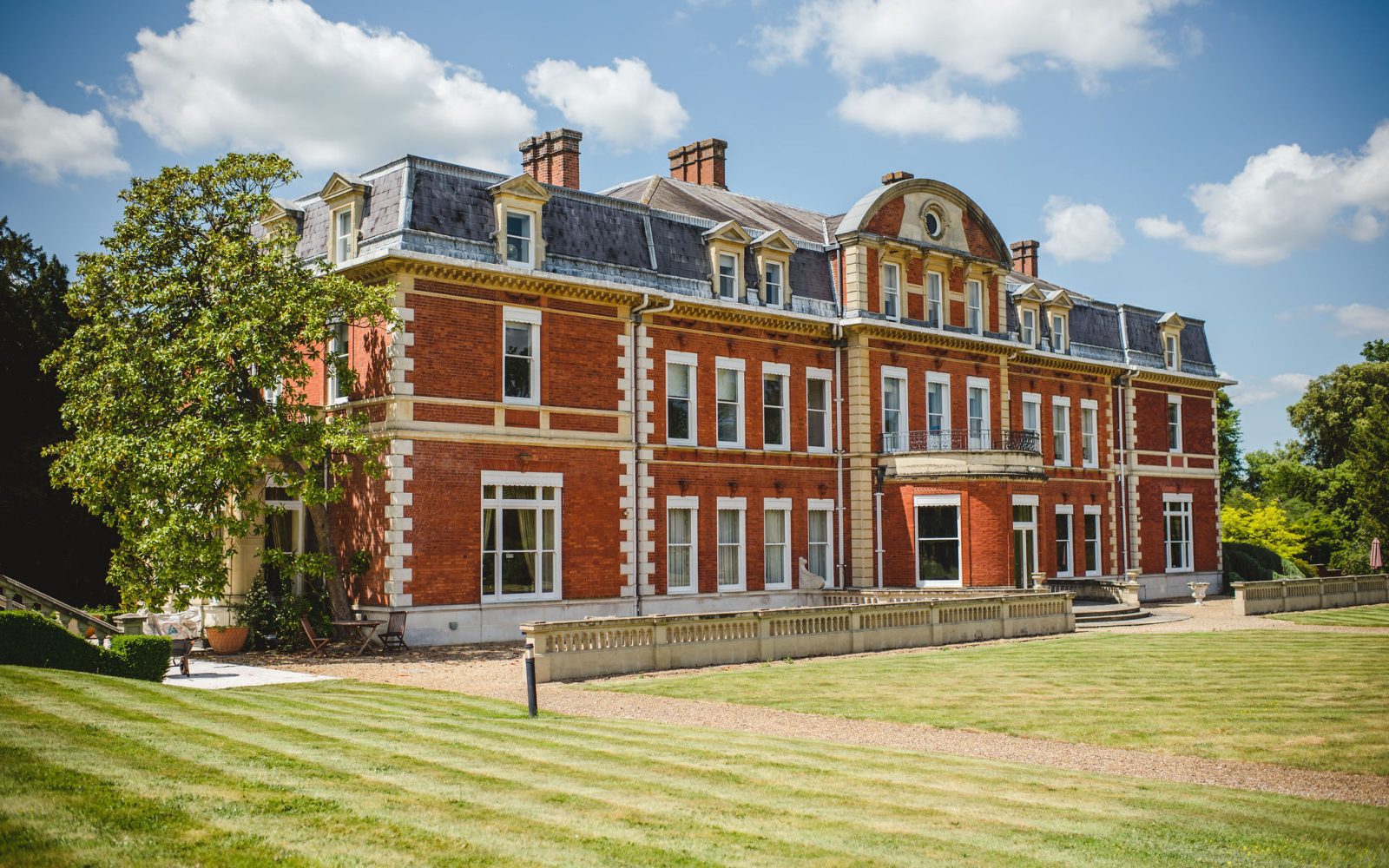 Landscaped grounds and picturesque gardens at Fetcham Park's serviced offices in Leatherhead