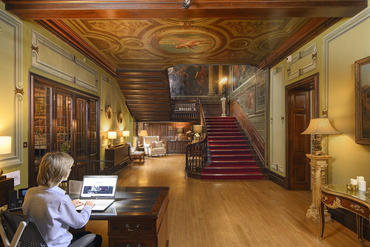 Breathtaking entrance hall at Fetcham Park with friendly receptionist to greet and welcome your visitors